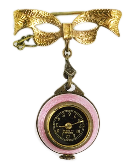 An early to mid 20th century silver and pink guilloche enamel Burger manual wind globe lapel watch, on a later 9ct gold ribbon bow suspension brooch